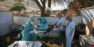 People caring for a patient in Sudan